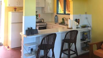 Maison, plusieurs lits, vue plage | Cuisine privée