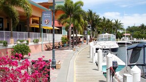 A waterfront restaurant with a dock, boats, and a sign reading "Boater's Landing." - Close your eyes and imagine - SW Cape waterfront home with fully Inclusive rates (Cape Coral)