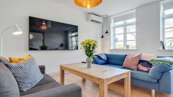 Comfort Apartment, Multiple Beds, Lake View | Living area | Flat-screen TV