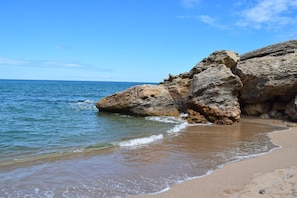 Enjoy the serene coastal views and gentle waves lapping at the shore.