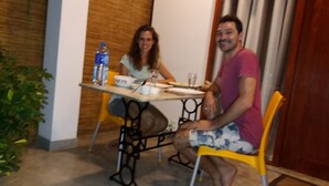 A dining table with chairs, a water bottle, and a glass. - Green Corridor - Ahangama (Ahangama)
