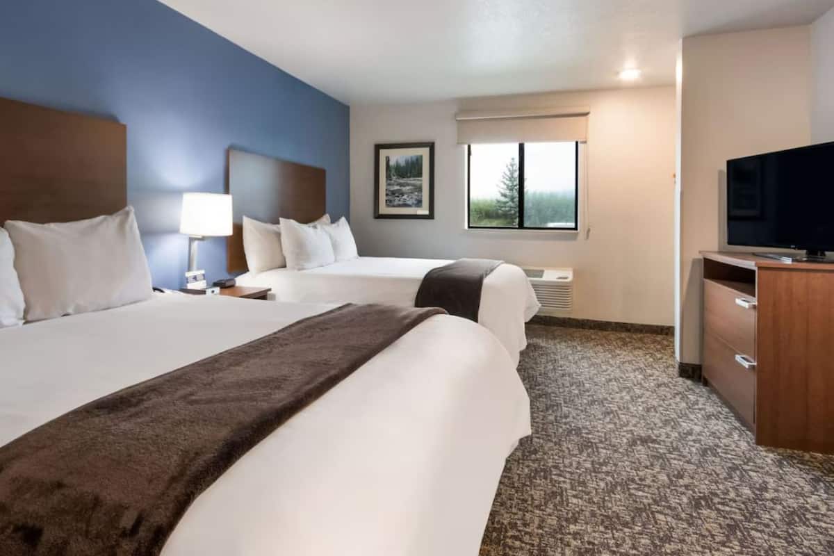 Premium bedding, pillow-top beds, desk, laptop workspace