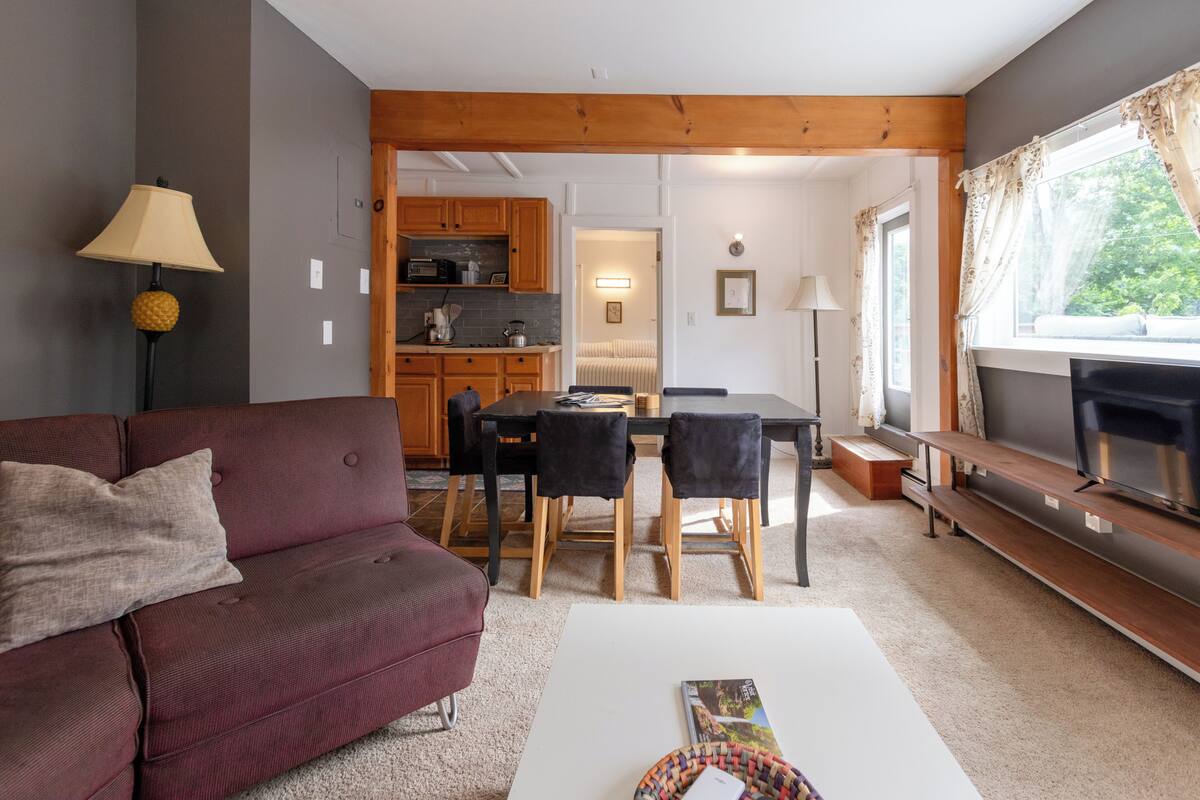 Chambre Triple Deluxe, vue montagne | Coin séjour