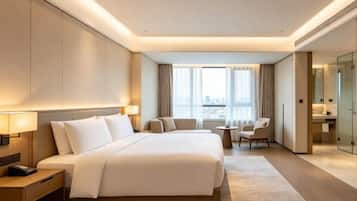 A hotel room with a large bed, bedside tables, a desk, and a view of the city.