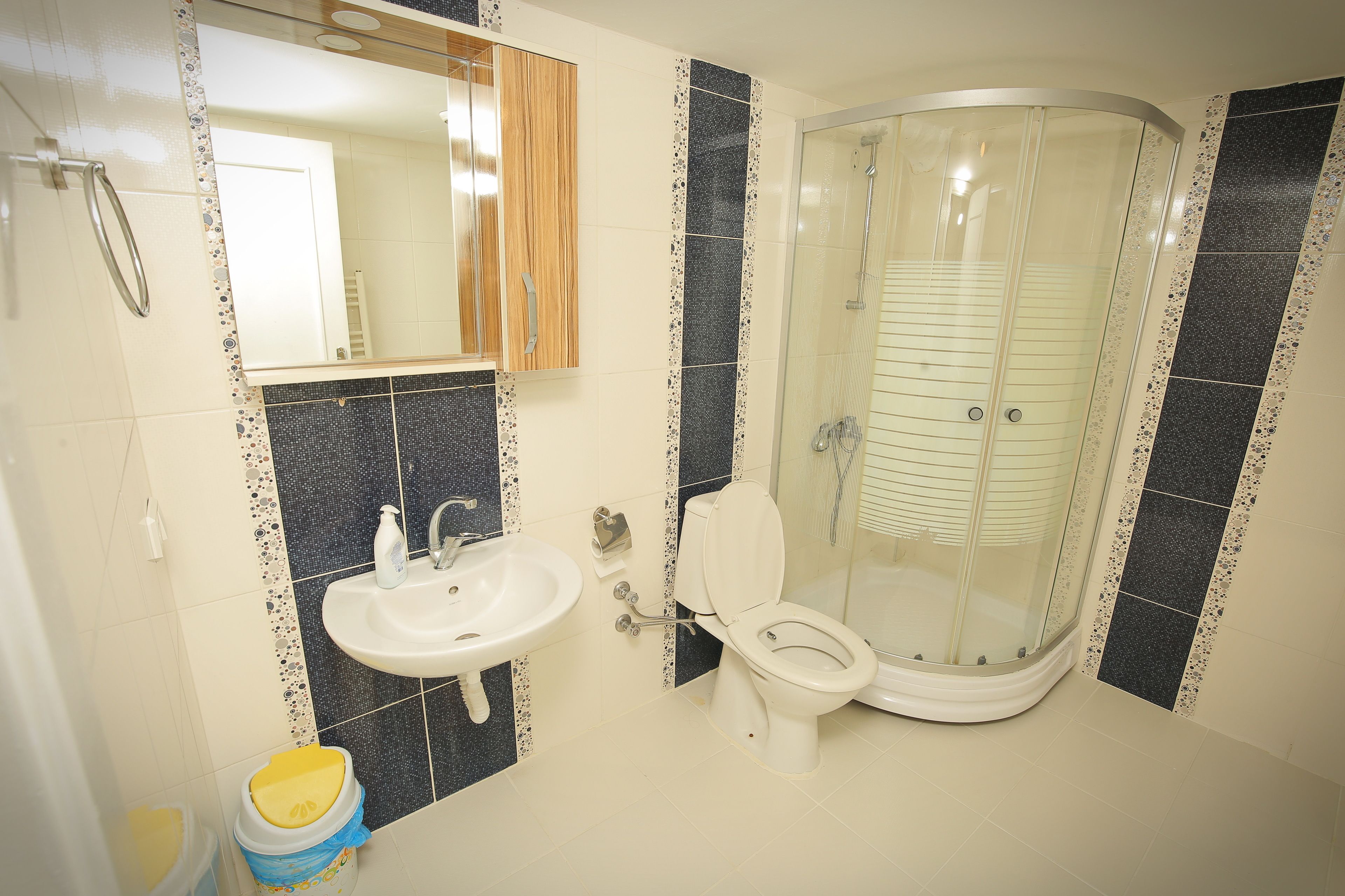 Shower, hair dryer, slippers, towels