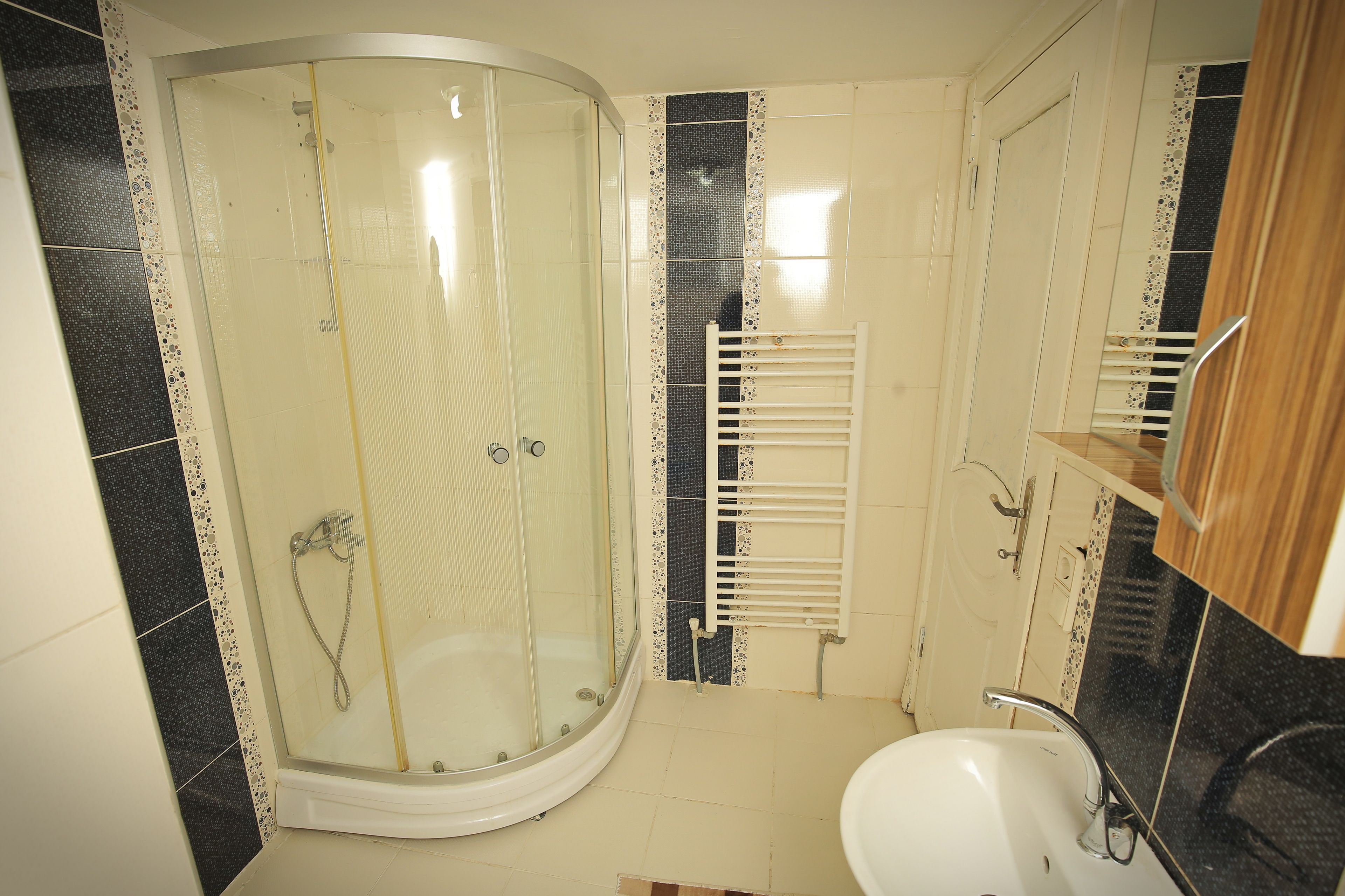 Shower, hair dryer, slippers, towels