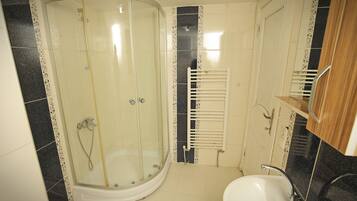 Shower, hair dryer, slippers, towels