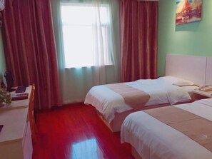 A hotel room with two beds, a desk with a computer, and a window with curtains. - GreenTree Inn Shanghai Songjiang District Sijing Town Sijing Metro Station Express Hotel (Shanghai)