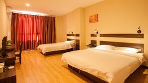 A hotel room with two beds, a desk, and a TV. - GreenTree Inn DaLian Ganjingzi District Airport New District Lazishan Express Hotel (Dalian)