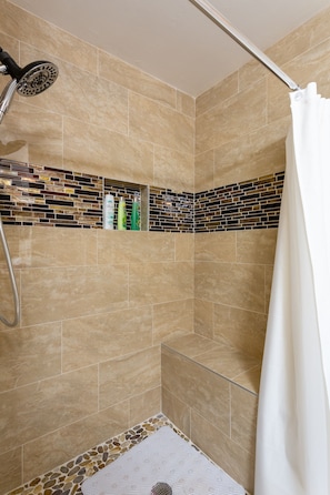 Bathtub, hair dryer, towels, soap