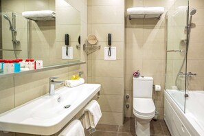A modern bathroom with a sink, toilet, and glass-enclosed shower. - Best Western Premier Plovdiv Hills (Plovdiv)