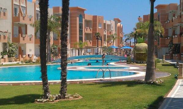 2 outdoor pools, open 9:00 AM to 6:00 PM, pool umbrellas, pool loungers