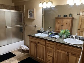 Combined shower/tub, hair dryer, towels, soap