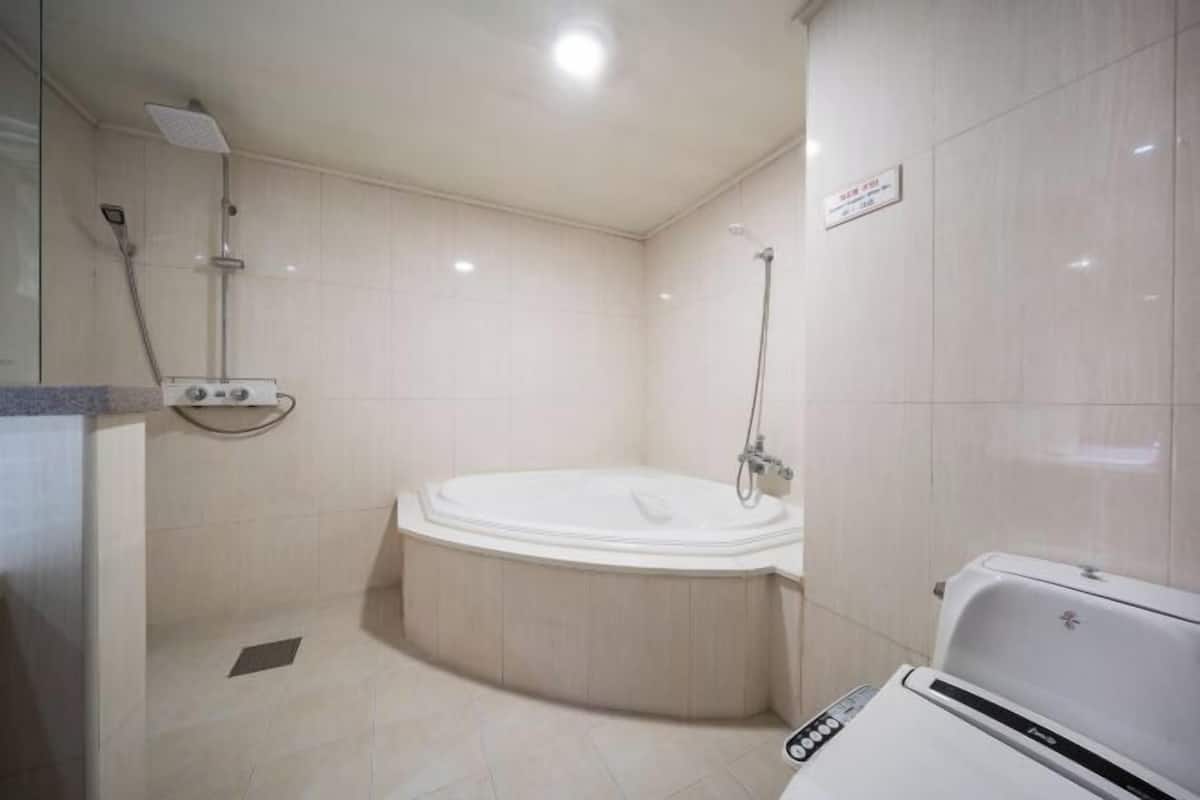 Bathroom | Combined shower/tub, deep soaking tub, hair dryer, slippers