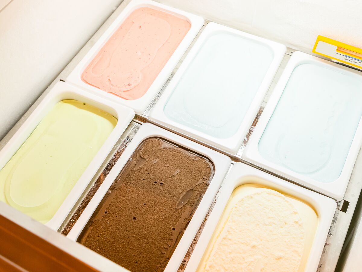 A set of ice cream containers in various colors.