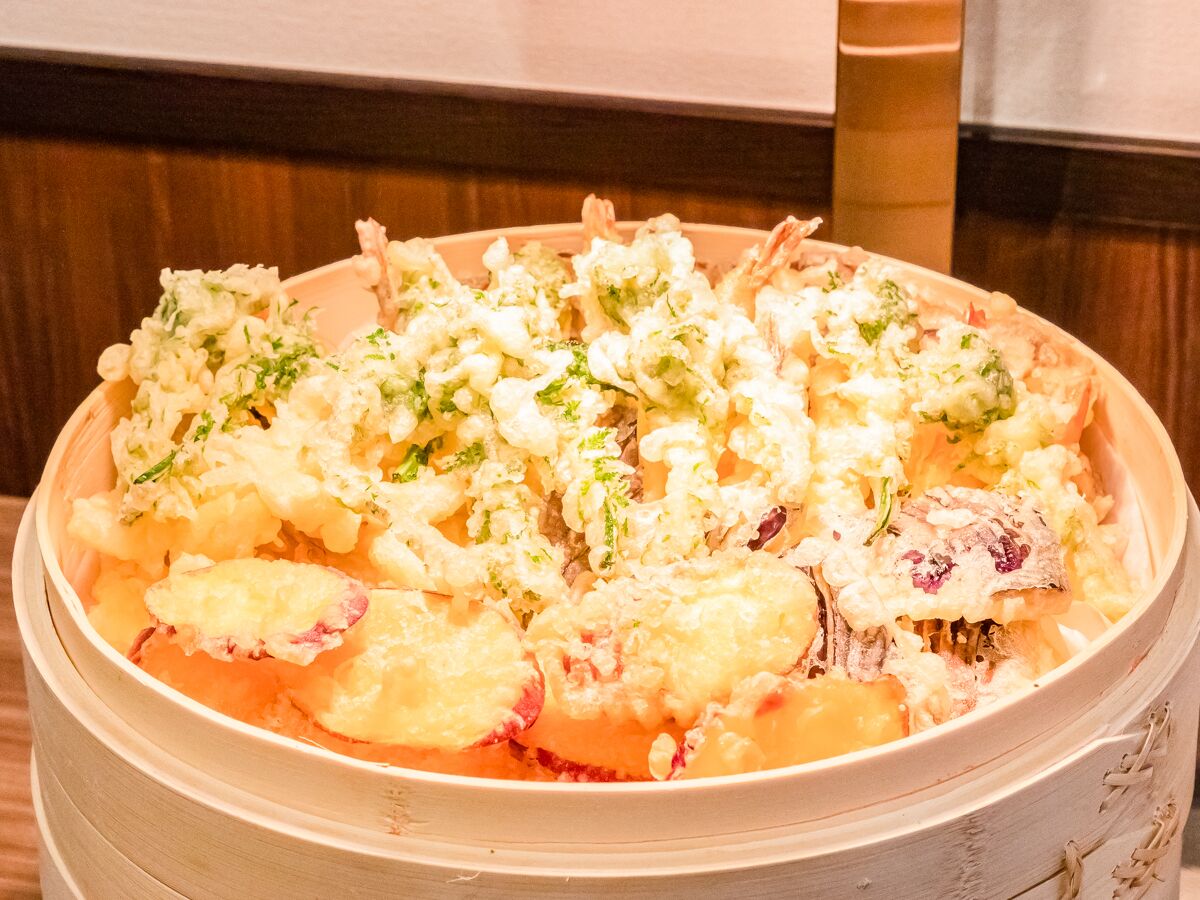 A traditional Japanese dish in a bamboo steamer.