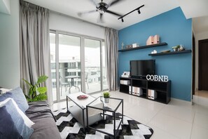 Two-Bedroom Apartment | Living room | LED TV - Regalia Residence by Cobnb (Kuala Lumpur)