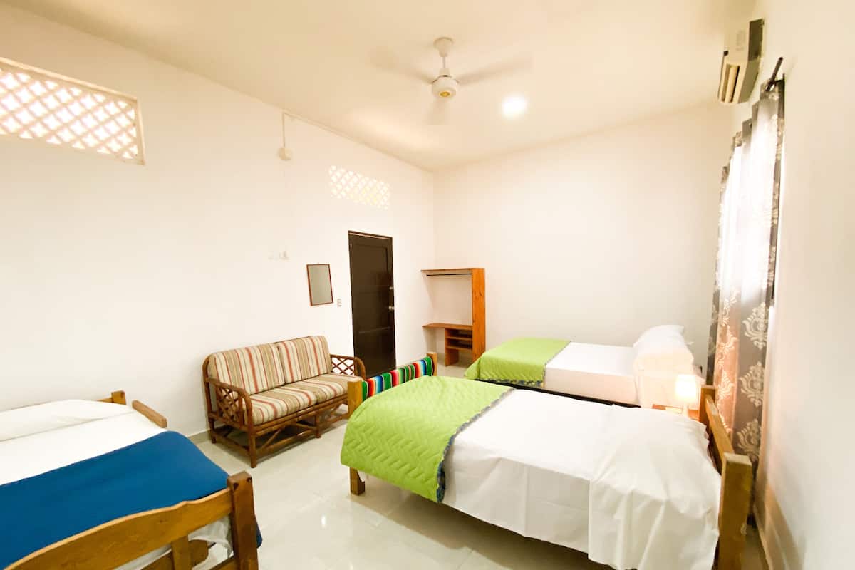 Economy Quadruple Room, Private Bathroom, Courtyard Area | Minibar, iron/ironing board, free WiFi, bed sheets