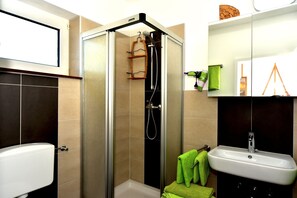 Regadera y secadora de cabello 