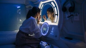 A room with a bed, a mirror, and a control panel. - Capsule Hotel 2nd BOX (Naha)