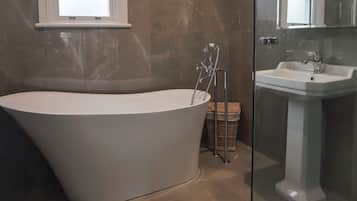 Bathtub, hair dryer, towels, soap