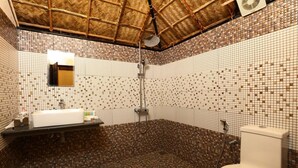 A bathroom with a tiled floor, a sink, a toilet, and a shower. - Shady Shores (Kanayannur)