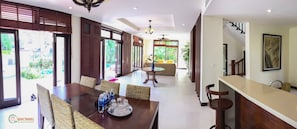 Enjoy a spacious hotel room with a dining area, large window, and modern design.