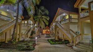 A hotel with multiple-story buildings, a central courtyard, and palm trees. - Laguna Beach (Morondava)