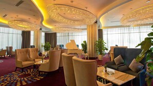 A luxurious lobby with high-end furniture, large chandeliers, and a red carpeted floor. - Worldhotel Grand Jiaxing Hunan (Changsha)