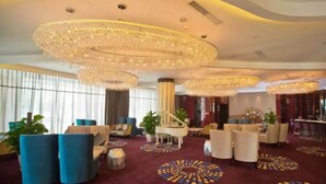 A luxurious lobby with a grand piano, plush seating, and ornate chandeliers. - Changsha Jiaxing Inn (Changsha)