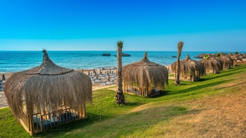 Private beach, free beach shuttle, free beach cabanas, sun loungers