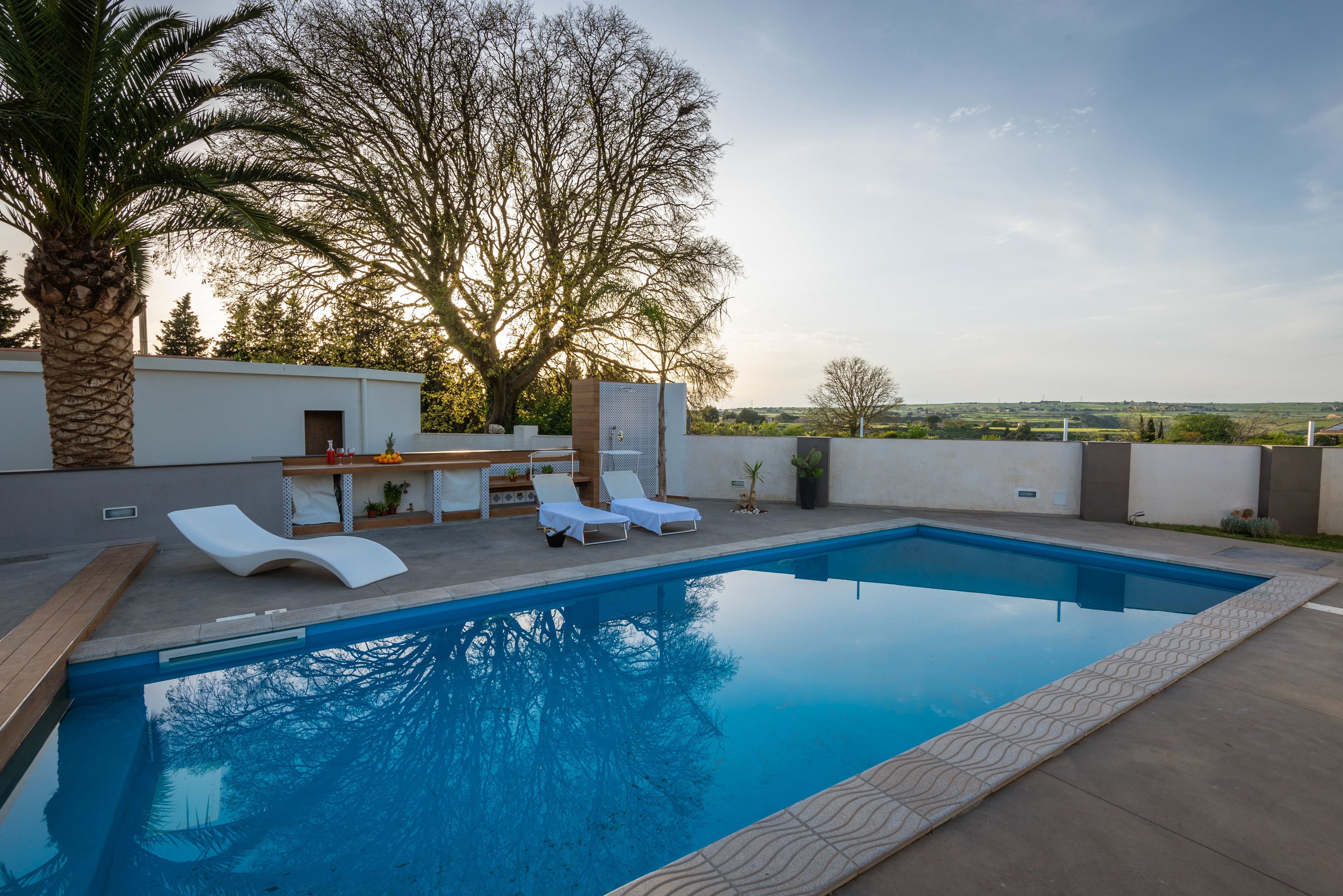 Seasonal outdoor pool, open 8:00 AM to 9:30 PM, pool loungers