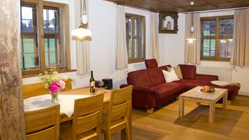 Luxury Suite, 2 Bedrooms, Terrace, Garden View | Living room | Flat-screen TV, DVD player