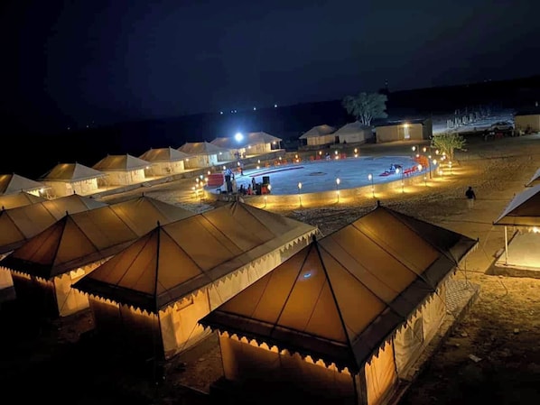 A series of tents with a central open space, possibly for communal activities.