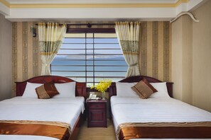 デラックス ダブルまたはツインルーム キングベッド 1 台 ビーチビュー | 部屋からの景観