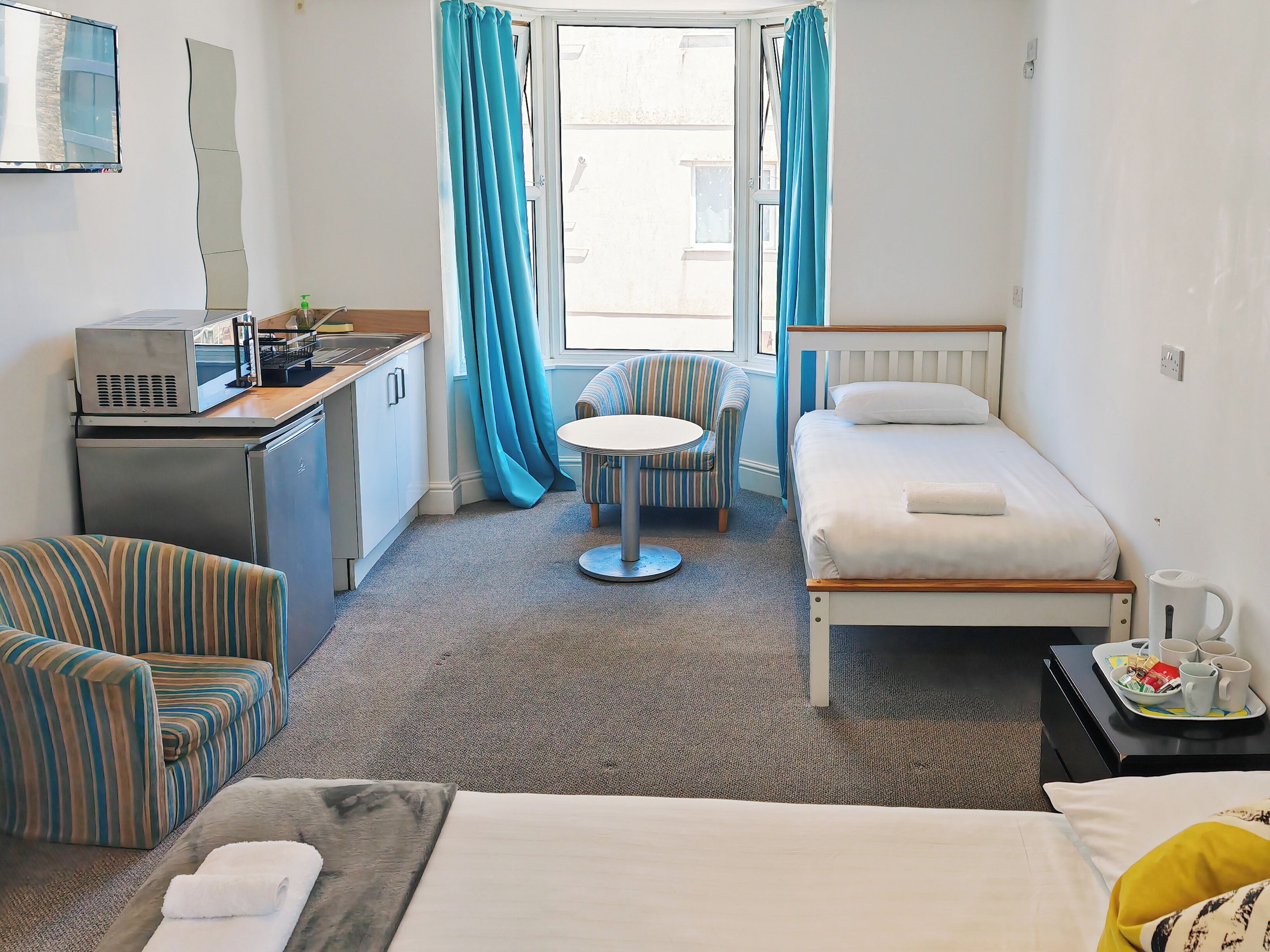 superior family room | private kitchen | mini-fridge, microwave, electric kettle, cookware/dishes/utensils