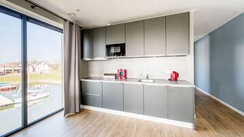 Apartment (Uithaven 10C) | Private kitchen | Fridge, microwave, oven, stovetop