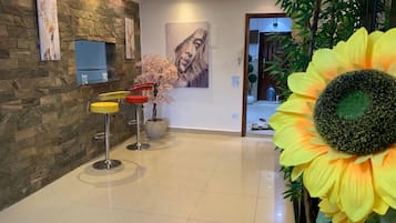 Elite Apartment | Living area | 32-inch Smart TV with satellite channels