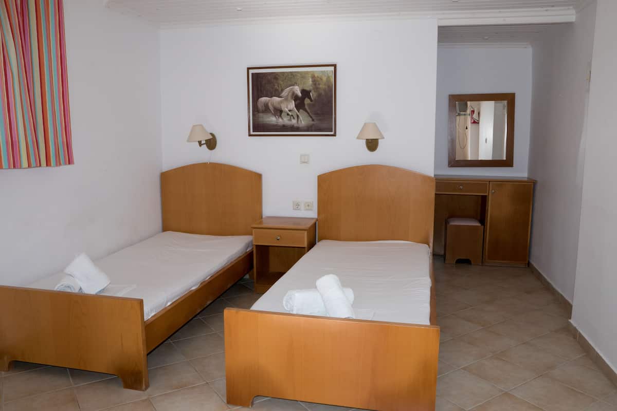 Economy Studio, 3 Twin Beds, Garden View | In-room safe, soundproofing, iron/ironing board, free WiFi