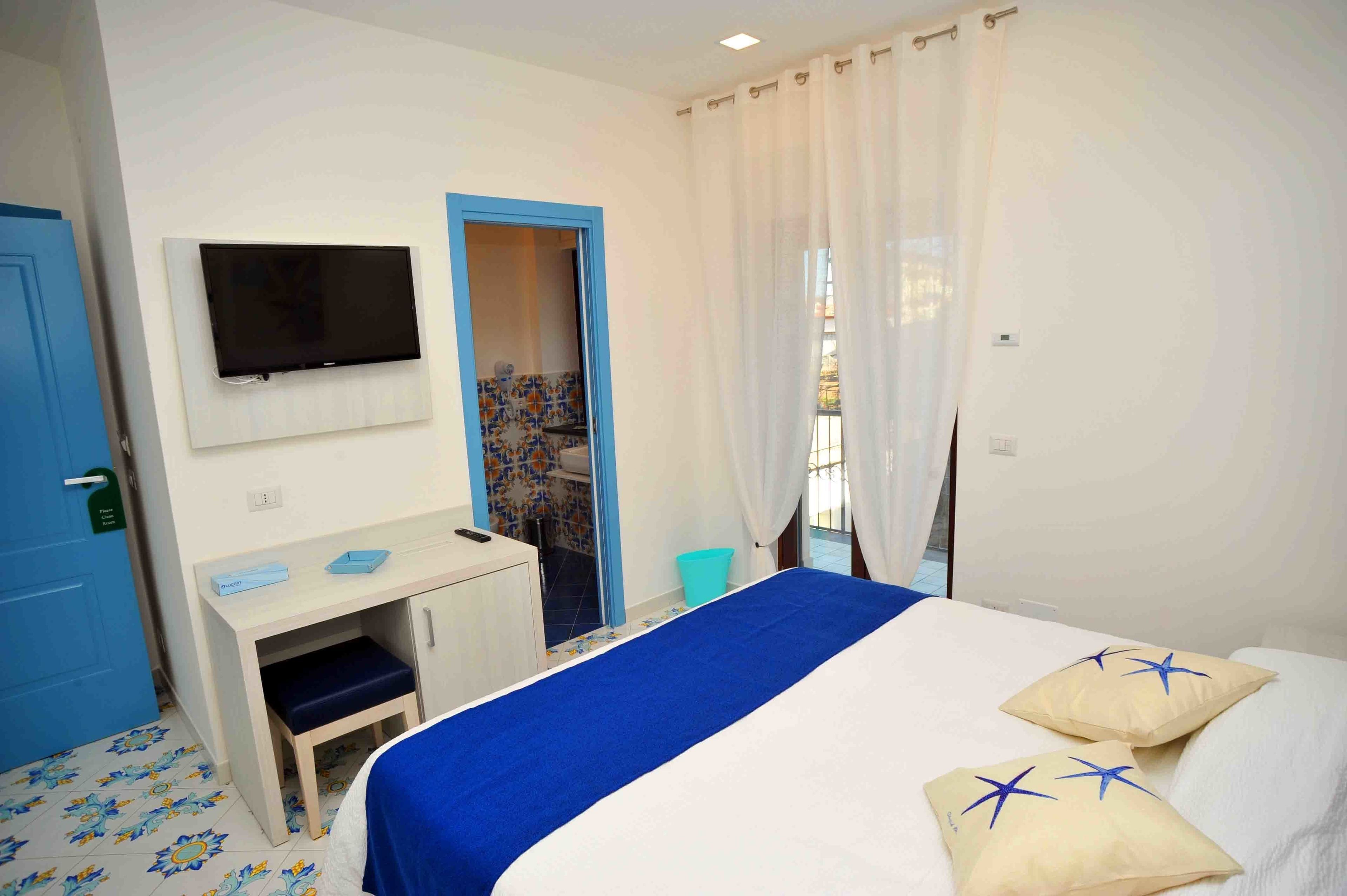 Chambre Confort Double ou avec lits jumeaux, 1 grand lit, vue jardin