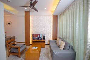 Executive Studio Suite, 1 Double Bed, Accessible, Ocean View | Living area | Flat-screen TV - EJB room at the Mactan Newton (Lapu-Lapu)