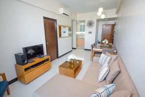 Exclusive Condo, 1 Double Bed, Accessible, Sea View | Living area | Flat-screen TV - EJB room at the Mactan Newton (Lapu-Lapu)
