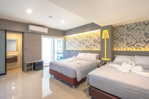Family Room with Balcony | In-room safe, desk, free WiFi, bed sheets