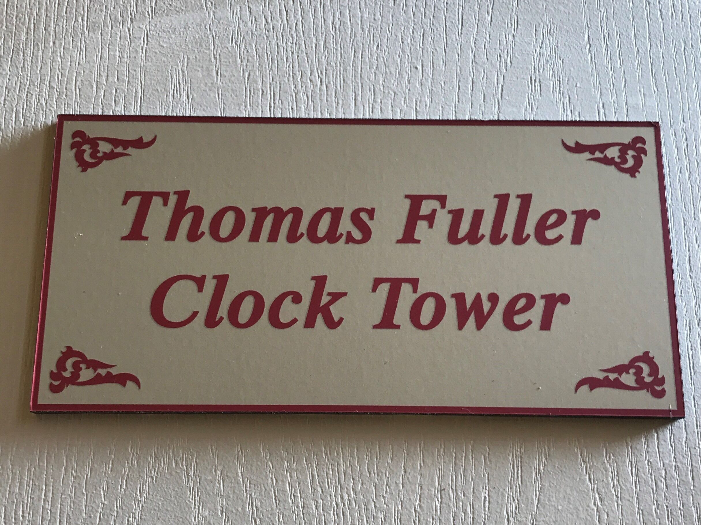 A sign with the text "Thomas Fuller Clock Tower".