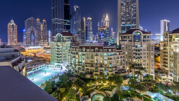 A high-rise hotel with multiple floors, large windows, and a rooftop terrace. - Roda Al Murooj Residences (Dubai)
