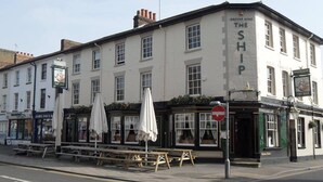 A corner building with a sign reading "The Ship" and a pub named "Greene King". - The Ship (Chelmsford)