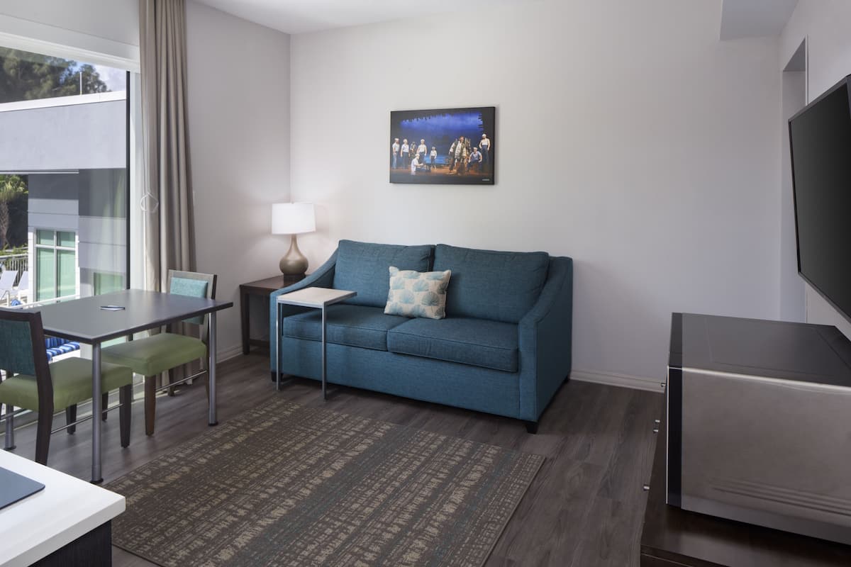 comfort suite, 1 king bed with sofa bed | living room | 36-inch tv with cable channels