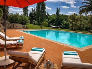 Seasonal outdoor pool, open 8:00 AM to 8:00 PM, pool umbrellas