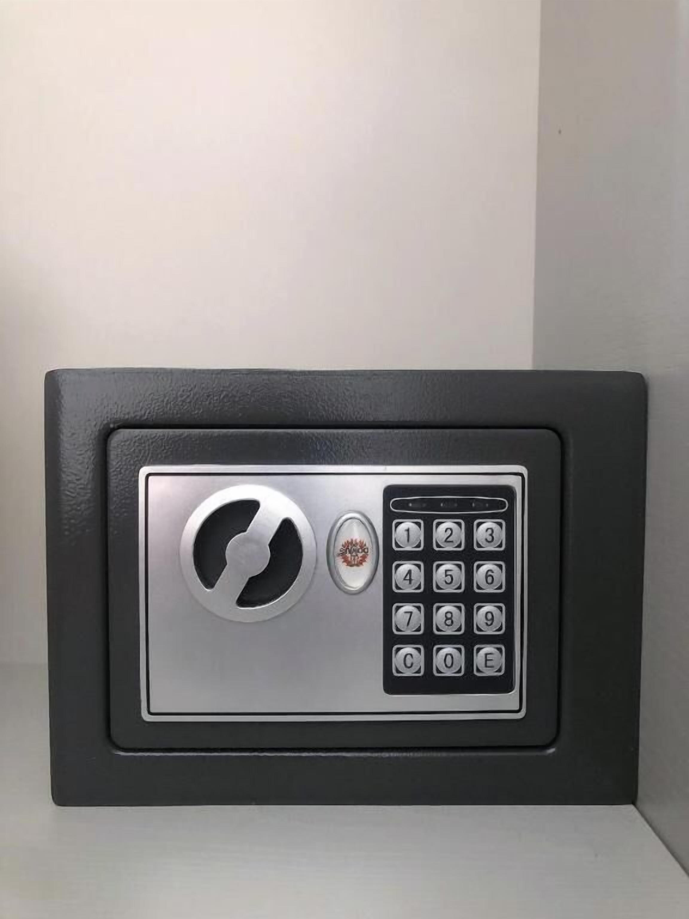 A black safe with a keypad and a circular lock mechanism.