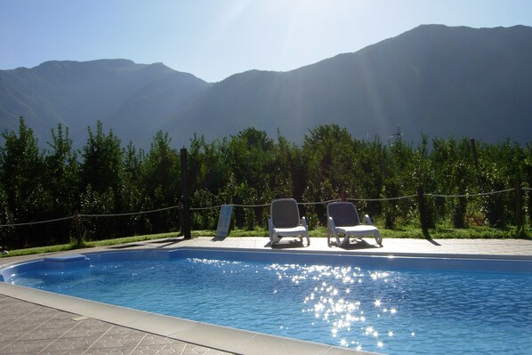 Outdoor pool, open 9:30 AM to 8:30 PM, pool umbrellas, pool loungers